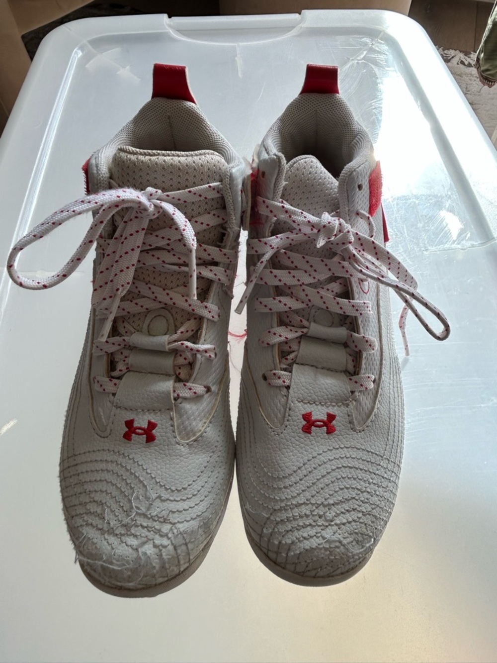 Under Armour Kids White Cleats with Red Accents